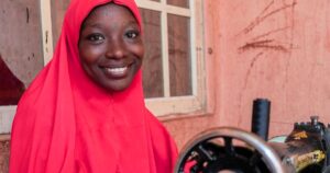 Read more about the article After a deadly raid, a displaced Nigerian mother finds a lifeline in sewing